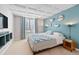 Bedroom with modern decor, textured ceiling, and a window at 3171 Fulton St, Denver, CO 80238