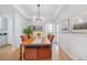 Bright dining area featuring stylish light fixture, and wood flooring, perfect for entertaining at 3171 Fulton St, Denver, CO 80238