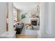 Bright living room featuring a fireplace, hardwood floors, and stylish modern decor at 3171 Fulton St, Denver, CO 80238