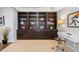 Living room features a full wall of built in bookshelves and a workspace at 3171 Fulton St, Denver, CO 80238