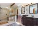 Bright bathroom featuring a glass shower, soaking tub, and double vanity with modern fixtures and stylish decor at 7264 Wembley Pl, Castle Pines, CO 80108