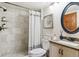 Updated bathroom with tiled shower, vanity, and modern fixtures at 7264 Wembley Pl, Castle Pines, CO 80108