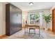 Bright bedroom with hardwood floors and a built-in Murphy bed at 7264 Wembley Pl, Castle Pines, CO 80108
