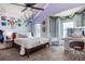 Charming bedroom with ample natural light, a decorative ceiling fan, and a unique hanging chair at 7264 Wembley Pl, Castle Pines, CO 80108