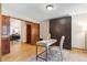 Home office with hardwood floors and a built-in Murphy bed at 7264 Wembley Pl, Castle Pines, CO 80108