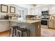Modern kitchen features granite countertops, stainless steel appliances, and ample counter space at 7264 Wembley Pl, Castle Pines, CO 80108