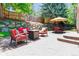 Backyard patio with comfortable seating and fire pit at 7264 Wembley Pl, Castle Pines, CO 80108