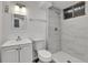 Well-lit bathroom features white tile shower, modern sink, and updated fixtures offers a clean space at 1759 Cedar St, Broomfield, CO 80020