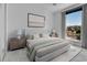 Serene bedroom with plush bedding, bedside lamps, and a window offering a view of the outdoors at 1759 Cedar St, Broomfield, CO 80020