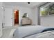 Bedroom featuring a dresser, stylish decor, and an ensuite bathroom at 1759 Cedar St, Broomfield, CO 80020