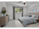 Comfortable bedroom with a plush bed, dresser, and a window offering a view of the outdoors at 1759 Cedar St, Broomfield, CO 80020