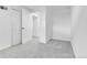 Bright bedroom featuring neutral carpet and walls plus a double-door closet at 1759 Cedar St, Broomfield, CO 80020