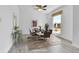 Bright dining room featuring a modern table set, natural light from a large window, and light wood floors at 1759 Cedar St, Broomfield, CO 80020