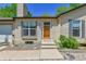 Home exterior showcasing a well-maintained front entrance, complemented by landscaped details and natural light at 1759 Cedar St, Broomfield, CO 80020