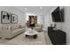 Cozy staged living room with neutral tones, modern furnishings, and fireplace at 1759 Cedar St, Broomfield, CO 80020