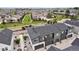 Stunning aerial view of a new neighborhood with lush green spaces and contemporary townhomes at 2054 S Upham Way, Denver, CO 80227