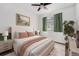 Stylishly furnished bedroom featuring soft lighting, a comfortable bed, and a verdant color palette at 2054 S Upham Way, Denver, CO 80227