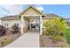 Welcoming community entrance with stone accents and manicured landscaping, leading to neighborhood amenities at 2054 S Upham Way, Denver, CO 80227