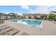 Large community pool with lounge seating surrounded by landscaped lawns and neighborhood homes at 2054 S Upham Way, Denver, CO 80227