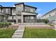 Modern two-story home featuring stone accents, a front porch, and well-maintained landscaping at 2054 S Upham Way, Denver, CO 80227