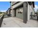 Inviting home featuring a covered porch with stone and wood accents, perfect for enjoying the outdoors at 2054 S Upham Way, Denver, CO 80227