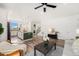 Open-concept living space leading into the kitchen, featuring hardwood floors and modern decor, for seamless living at 2054 S Upham Way, Denver, CO 80227
