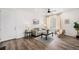 Inviting living area with wood floors, neutral-toned furniture, and natural light from a nearby window at 2054 S Upham Way, Denver, CO 80227