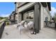 Inviting front patio with comfortable seating, stylish decor, and well-maintained landscaping at 2054 S Upham Way, Denver, CO 80227