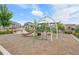 Community playground with slide, climbing structure, and bench seating at 2054 S Upham Way, Denver, CO 80227