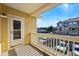 Small balcony with view of parking area between buildings on a sunny day at 9434 Ashbury Cir # 203, Parker, CO 80134