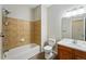 A cozy bathroom with a tub, shower, toilet, sink, and vanity with good natural lighting at 9434 Ashbury Cir # 203, Parker, CO 80134