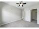 Bedroom with gray carpet and ceiling fan, features a closet at 9434 Ashbury Cir # 203, Parker, CO 80134
