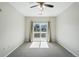 Bright bedroom with sliding glass doors leading to a balcony at 9434 Ashbury Cir # 203, Parker, CO 80134