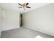 Spacious bedroom features neutral walls and carpet, with a ceiling fan fixture at 9434 Ashbury Cir # 203, Parker, CO 80134