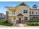 Charming condo exterior features a private balcony and stone accents for added curb appeal at 9434 Ashbury Cir # 203, Parker, CO 80134