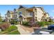 Beautiful townhome exterior showcasing well-maintained landscaping and inviting curb appeal at 9434 Ashbury Cir # 203, Parker, CO 80134
