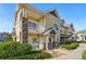 Inviting townhome with charming stone accents and a private balcony for outdoor enjoyment at 9434 Ashbury Cir # 203, Parker, CO 80134