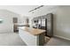 Modern kitchen with stainless steel appliances, ample gray cabinetry, and a large island with countertop at 9434 Ashbury Cir # 203, Parker, CO 80134
