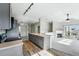 Modern kitchen featuring stainless steel appliances, an island, and an open layout to the living space at 9434 Ashbury Cir # 203, Parker, CO 80134