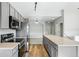 Well-equipped kitchen with stainless steel appliances, ample counter space, and a functional layout at 9434 Ashbury Cir # 203, Parker, CO 80134