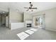 Bright living room featuring a cozy fireplace and sliding glass doors to a balcony at 9434 Ashbury Cir # 203, Parker, CO 80134