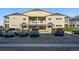 A two-story apartment building with a full parking lot at 9434 Ashbury Cir # 203, Parker, CO 80134