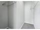 A bright walk-in closet with neutral walls, shelf and gray carpet at 9434 Ashbury Cir # 203, Parker, CO 80134