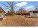 Large backyard with a wooden fence providing privacy and a shed for extra storage space at 1515 Sagrimore Cir, Lafayette, CO 80026