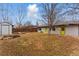 Spacious backyard with a large lawn, shed, and mature trees creating a serene outdoor space at 1515 Sagrimore Cir, Lafayette, CO 80026