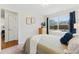 Cozy bedroom with natural light and a peaceful view of the backyard through the window at 1515 Sagrimore Cir, Lafayette, CO 80026