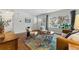 Inviting living room with hardwood floors, lots of natural light, and a colorful area rug at 1515 Sagrimore Cir, Lafayette, CO 80026