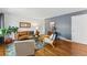 Stylish living room with hardwood floors, bright accents, and a comfortable seating area at 1515 Sagrimore Cir, Lafayette, CO 80026
