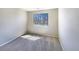 A cozy bedroom featuring neutral walls and soft carpeting with a window to let in natural light at 441 Grey Swallow St, Brighton, CO 80601