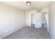 A spacious bedroom features soft carpet, neutral paint, and ample closet space at 441 Grey Swallow St, Brighton, CO 80601